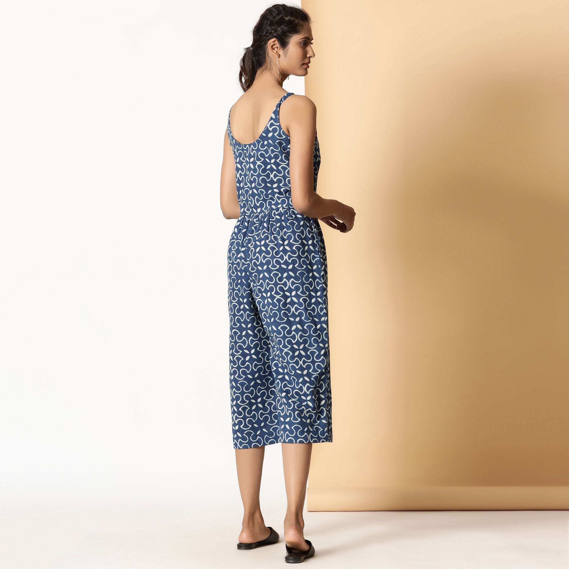 Back View of a Model wearing Indigo Dabu Block Printed Button-Down Jumpsuit