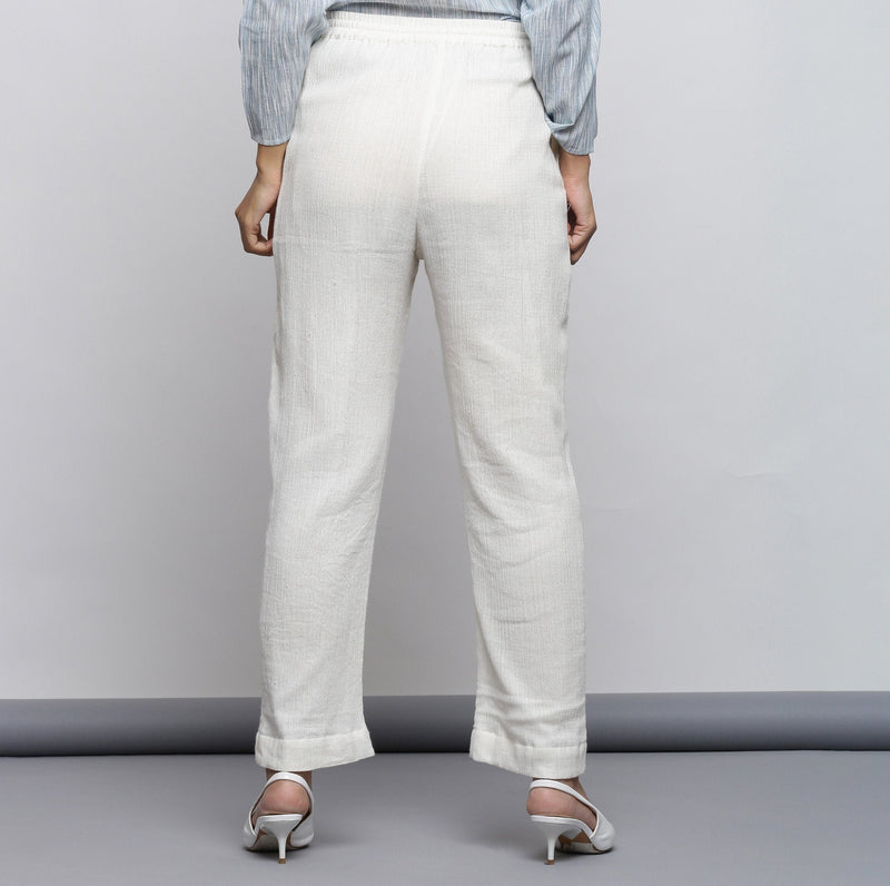 Back View of a Model wearing Off-White Crinkled Cotton Tapered Pant