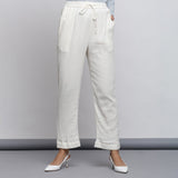 Front View of a Model wearing Off-White Crinkled Cotton Tapered Pant