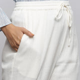Front Detail of a Model wearing Off-White Crinkled Cotton Tapered Pant