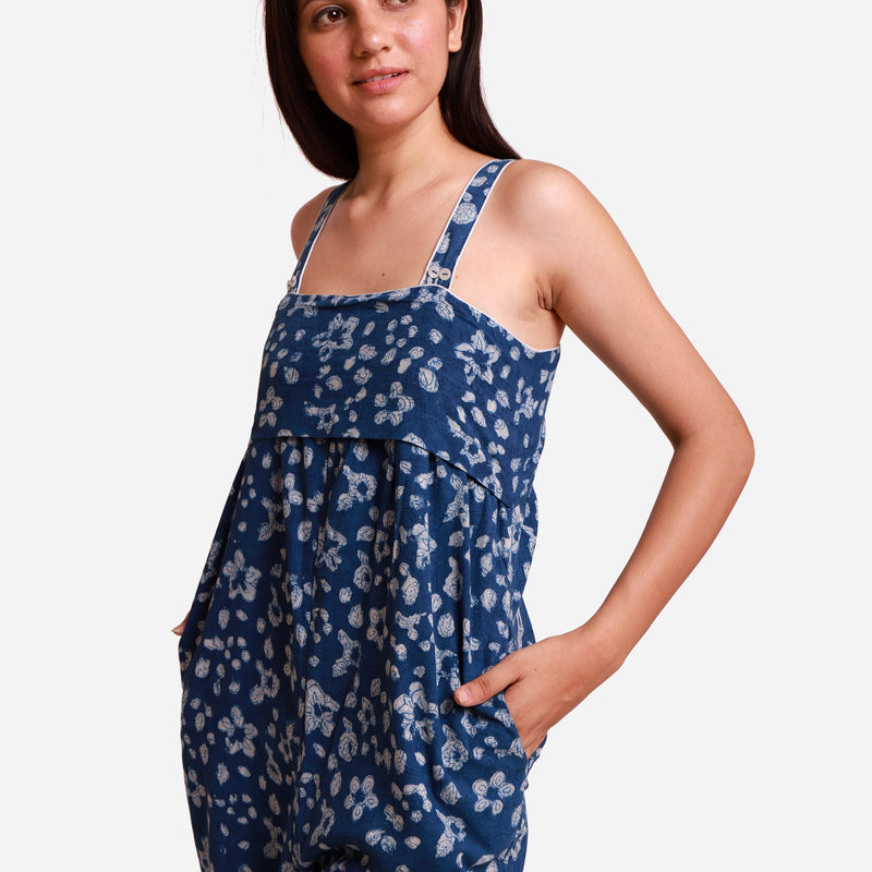 Left Detail of a Model wearing Indigo Flared Midi Floral Jumpsuit