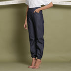 Left View of a Model wearing Indigo Cotton Denim Jogger Pant
