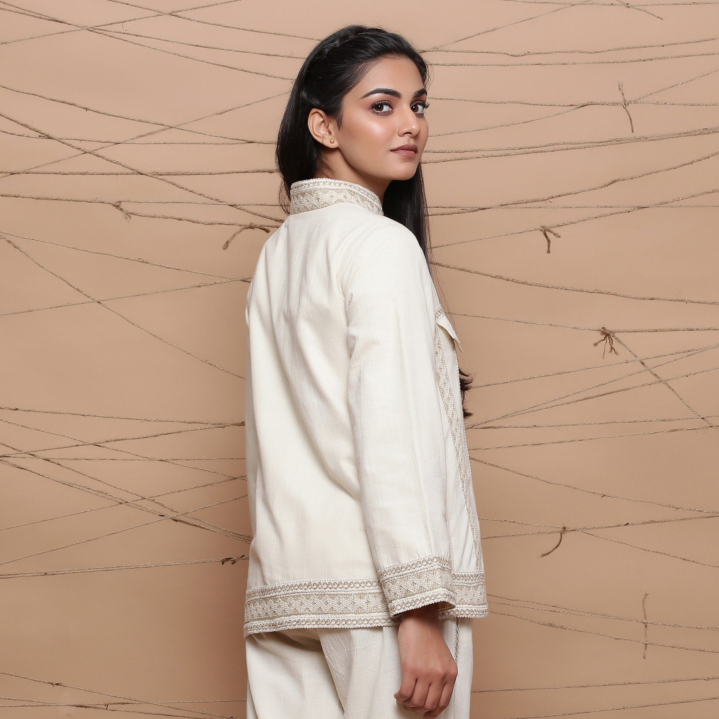 Back View of a Model wearing Undyed Handspun Jute Lace Cargo Jacket