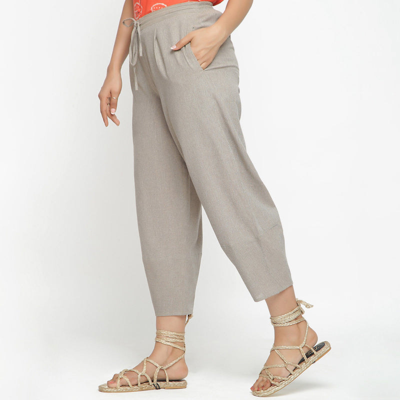 Left View of a Model wearing Yarn Dyed Cotton Beige Paneled Pant