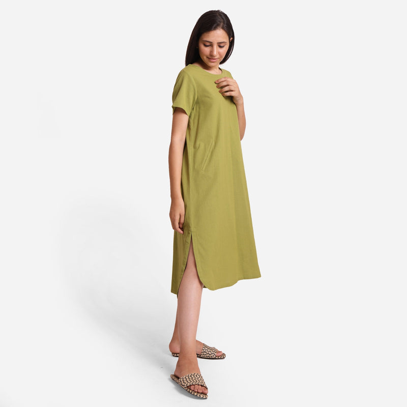 Right View of a Model wearing Khaki Green Cotton Welt Pocket Dress