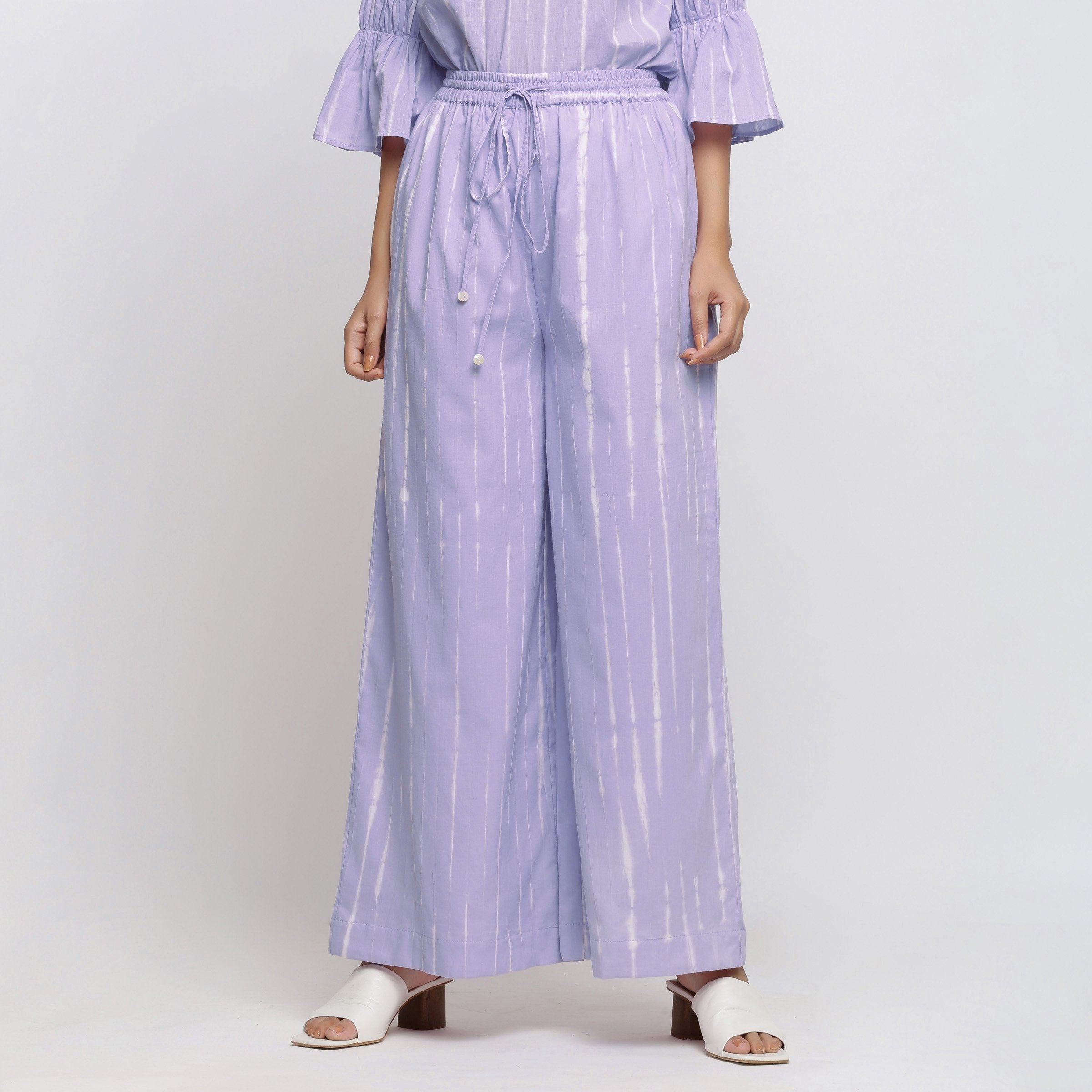 Front View of a Model wearing Lavender Tie Dye Wide Legged Palazzo Pant