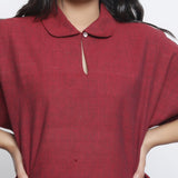 Front Detail of a Model wearing Maroon Round Collar Straight Top