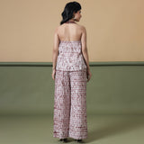 Back View of a Model wearing Maroon Shibori Flared Top and Pant Set