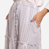 Front Detail of a Model wearing White Crinkled Cotton Tier Maxi Skirt