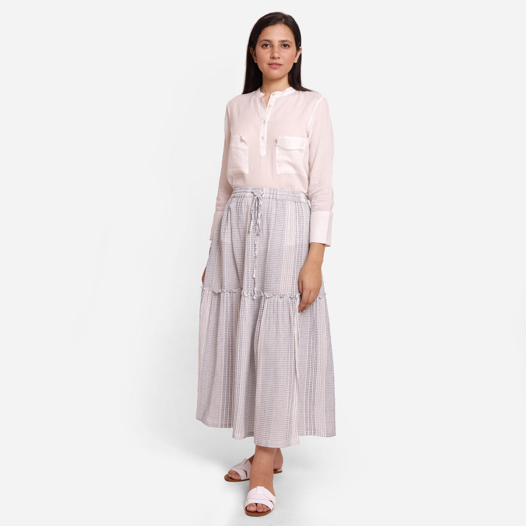 Front View of a Model wearing White Crinkled Cotton Tier Maxi Skirt