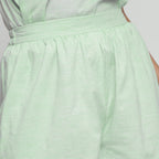 Front Detail of a Model wearing Mint Green Cotton Chambray Shorts