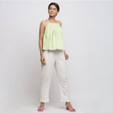 Front View of a Model wearing Mint Green Top and White Tapered Pant Set