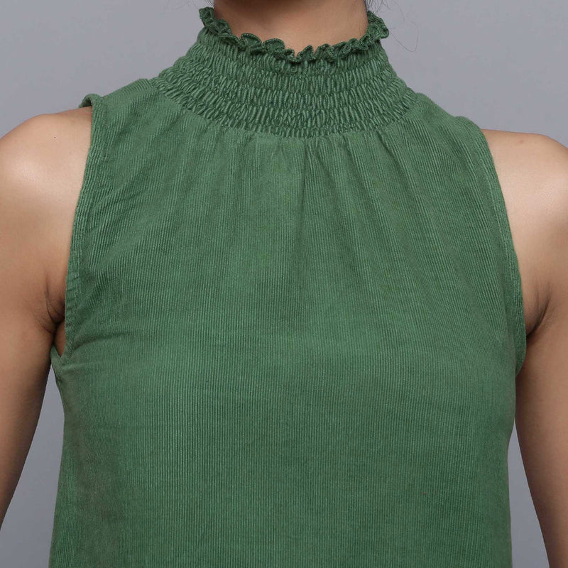 Front Detail of a Model wearing Green Cotton Corduroy High Neck Top