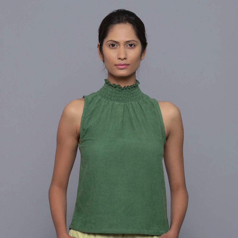 Front View of a Model wearing Green Cotton Corduroy High Neck Top
