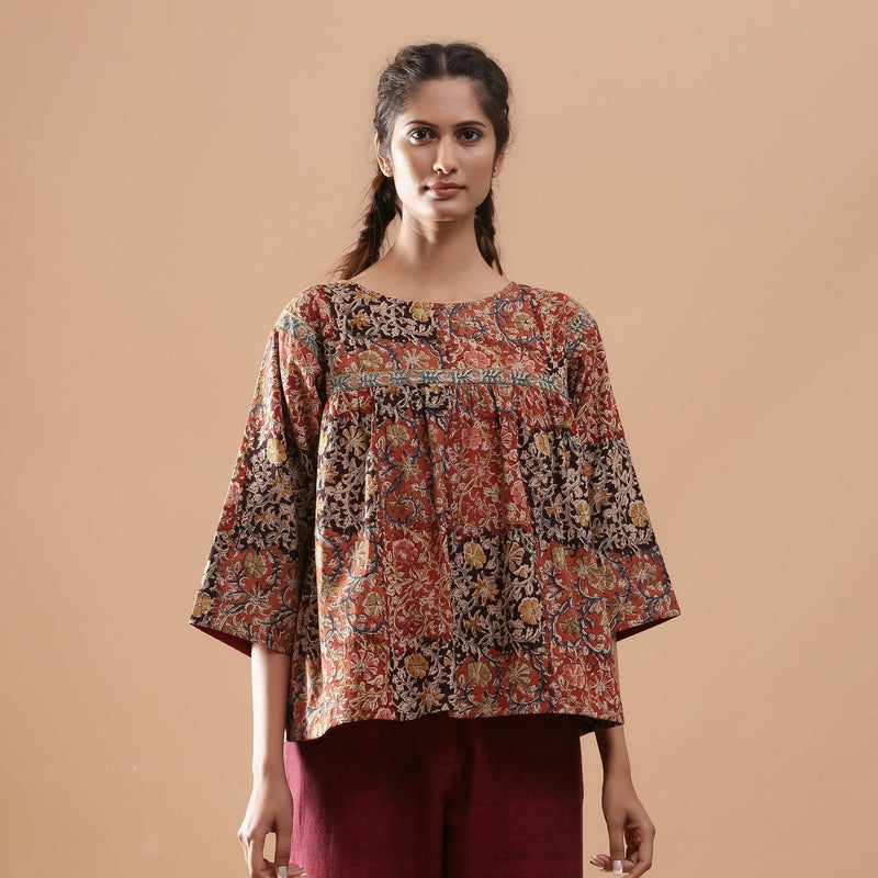 Front View of a Model wearing Muddy Red Kalamkari Flannel Floral Top