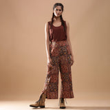 Front View of a Model wearing Muddy Red Wide-Leg Kalamkari Slit Pant