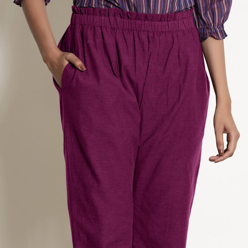Front Detail of a Model wearing Warm Mulberry Frilled Waist Tapered Cotton Pant