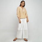 Front View of a Model wearing Mustard Hand Block Printed Straight Top