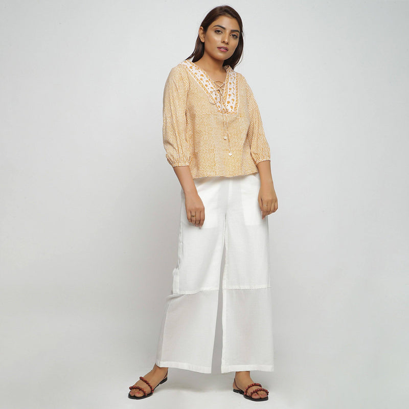Front View of a Model wearing Mustard Straight Top and Wide Legged Pant Set