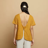 Back View of a Model wearing Mustard Cotton U-Neck Straight Top