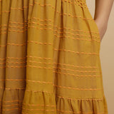Close View of a Model wearing Mustard V-Neck Handwoven Tier Dress