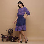 Left View of a Model wearing Navy Blue Ikat Handspun Tier Skirt