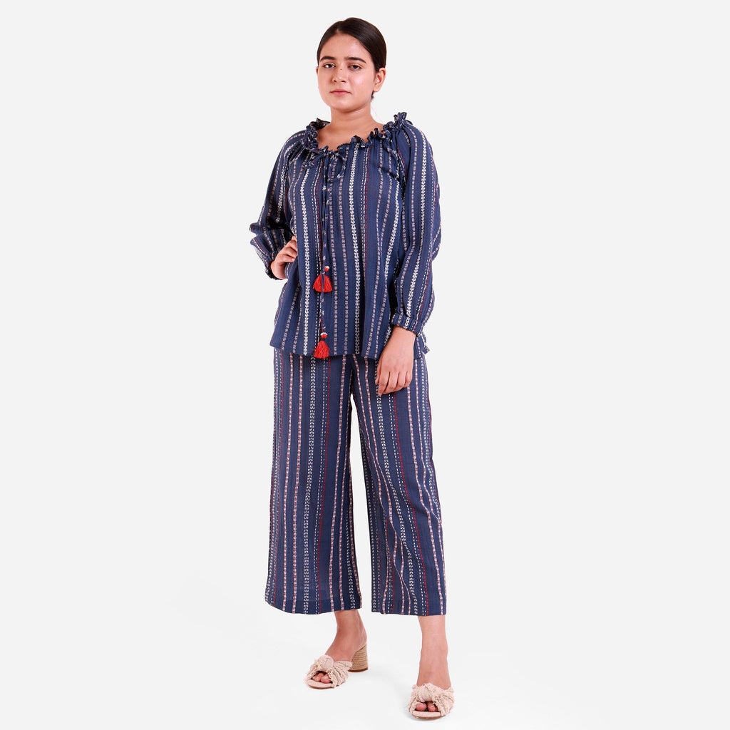Front View of a Model wearing Navy Blue Off-Shoulder Top and Striped Culottes