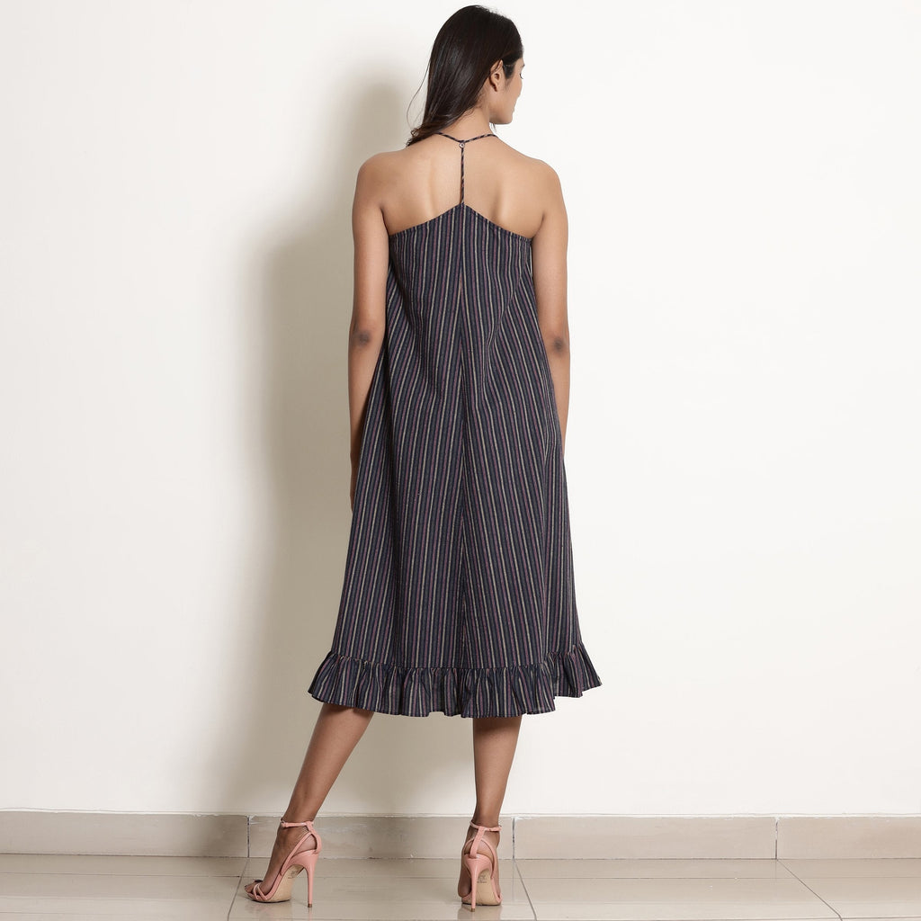 Back View of a Model wearing Navy Blue Striped Halter Neck Frilled Dress