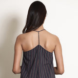 Back Detail of a Model wearing Navy Blue Striped Halter Neck Frilled Dress