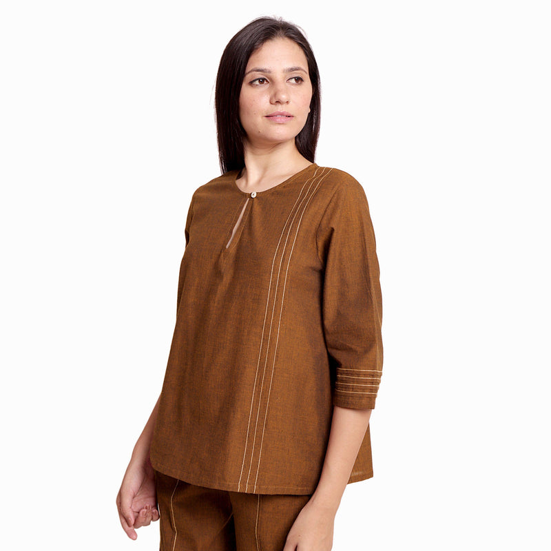 Left View of a Model wearing Handspun Oak Brown Cotton Straight Top