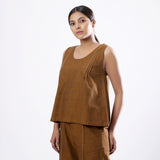 Left View of a Model wearing Handspun Oak Brown Straight Cotton Top