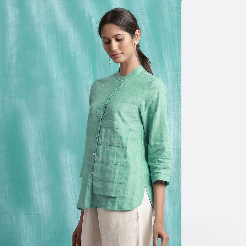 Left View of a Model wearing Ocean Green Handspun 100% Cotton Button-Down Top