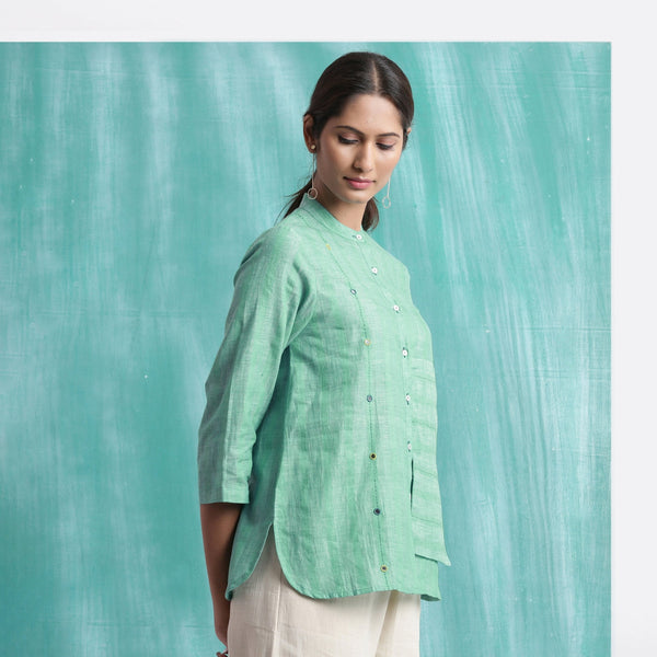 Right View of a Model wearing Ocean Green Handspun 100% Cotton Button-Down Top