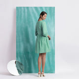 Back View of a Model wearing Ocean Green Handspun 100% Cotton Gathered Dress