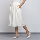 Left View of a Model wearing Off-White Crinkled Cotton Flared Skirt