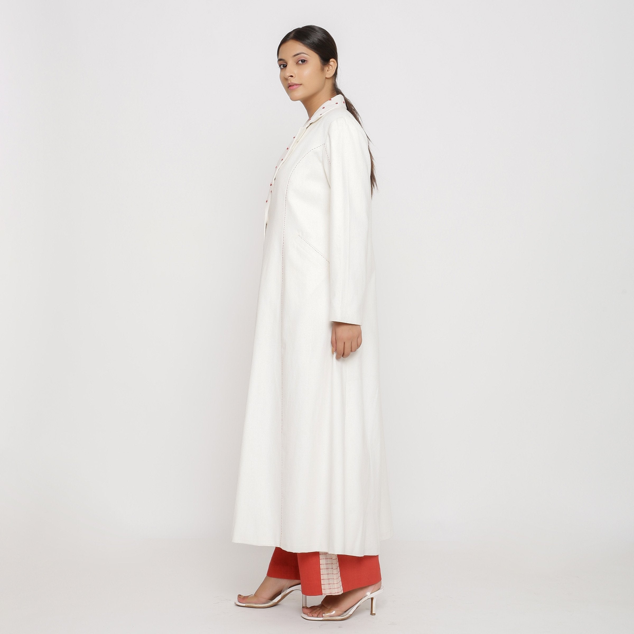 Left View of a Model wearing Off-White Hand Beaded Princess Line Overcoat