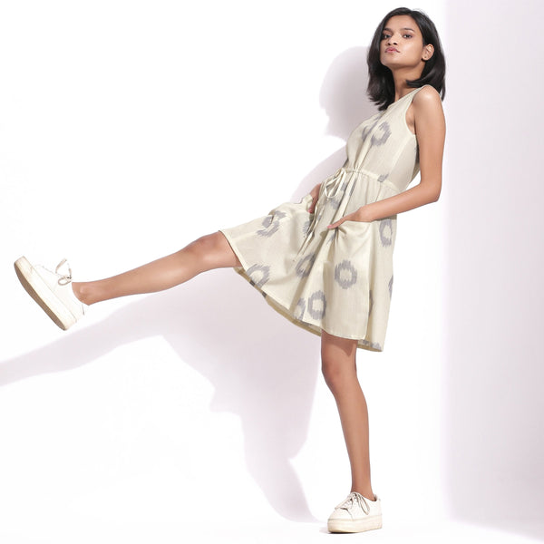 Left View of a Model wearing Off-White Handwoven Ikat Paneled Dress