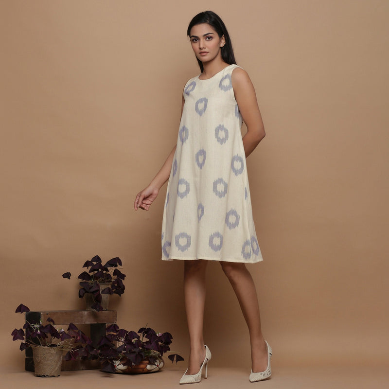 Left View of a Model wearing Off-White Paneled Sleeveless Cotton Dress