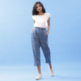 Front View of a Model wearing Off-White Straight Top and Indigo Pant Set