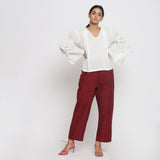 Front View of a Model Wearing Off-White V-Neck Top and Maroon Pant Set