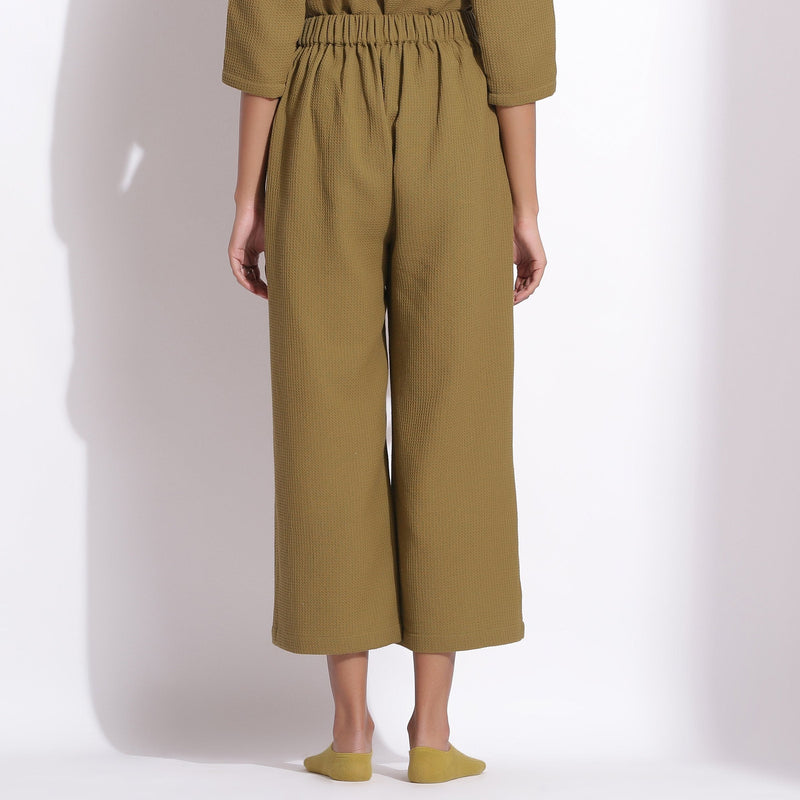 Back View of a Model wearing Olive Green Cotton Waffle Relaxed Culottes
