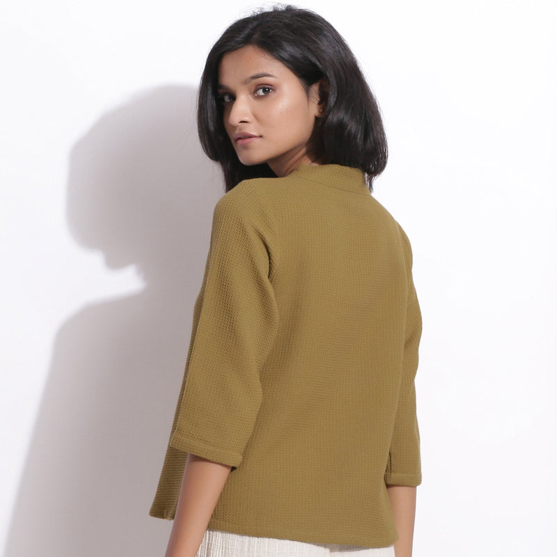Back View of a Model wearing Olive Green Cotton Waffle Button-Down Top