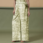 Left View of a Model wearing Olive Green Shibori Paperbag Cotton Pant