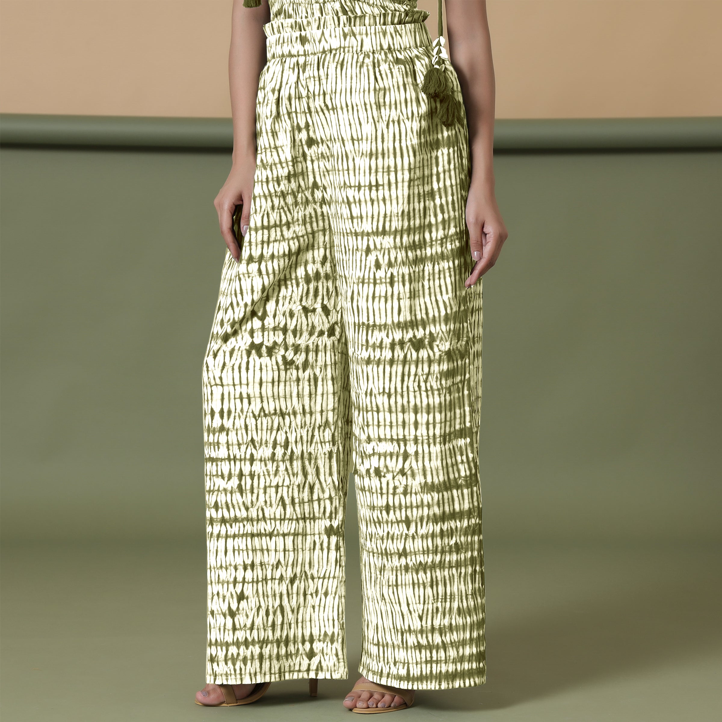 Left View of a Model wearing Olive Green Shibori Paperbag Cotton Pant