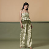 Right View of a Model wearing Olive Green Camisole Top and Shibori Pant Set
