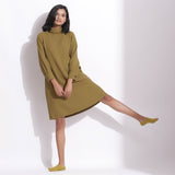 Front View of a Model wearing Olive Green Cotton Waffle Turtle Neck Dress