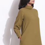 Front Detail of a Model wearing Olive Green Cotton Waffle Turtle Neck Dress