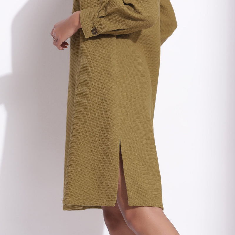 Left Detail of a Model wearing Olive Green Cotton Waffle Turtle Neck Dress