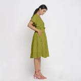 Right View of a Model wearing Olive Green Deep Neck Bohemian Frilled Dress