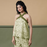 Left View of a Model wearing Olive Green Halter Neck Flared Cotton Top